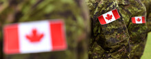 Canada Day. Flag Of Canada On The Military Uniform And Red Maple Leaf On The Background. Canadian Soldiers. Army Of Canada. Canada Leaf. Remembrance Day. Poppy Day.