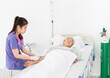 © jokekung - close up old patient, healthcare worker use syringe and needle inject solution medicine to old asian patient, palliative patient wear oxygen cannula and sleep in hospital