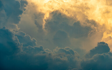 A close up of some clouds lit by golden light in amongst the storm