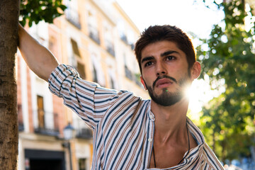 Young boy posing with a seductive look