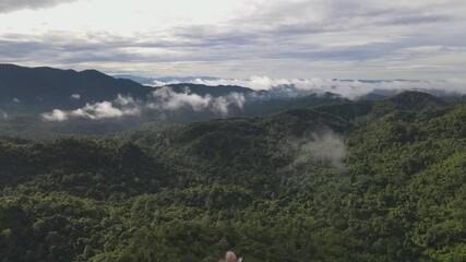 Wall Mural - Aerial view, Beautiful Panorama landscape sunrise over peak Mountain with mist and warm light sunrise at signal repeater station pole,  Communication technology concept. Mae Moh Lampang, Thailand.