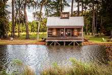Scenic View Of The Front Exterior Of A Rural Rustic Wooden Camp House Used For Rental, Cabin, Rustic, Home, House, Front, Georgia, Remote, Hunting, Camand Hunting. The House Is Located On A Large Pond