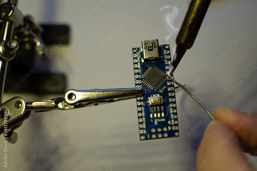 Stock-Foto „The process of soldering wires to an arduino nano board ...