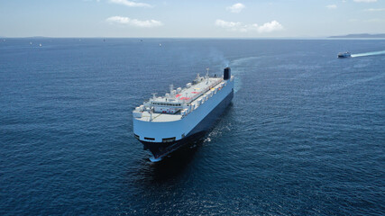 aerial drone photo of huge car carrier ship ro-ro (roll on roll off) cruising in mediterranean deep 