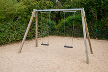 Empty Chain Swings Wooden Balance For Children In Garden Park