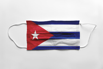 Wall Mural - Face mask with Cuba flag printed, on white background, isolated