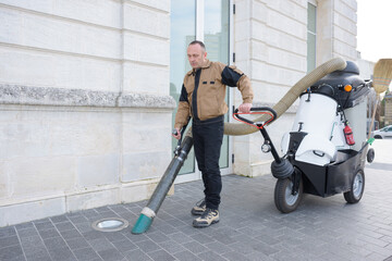 a male public street cleaner