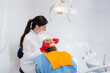 © Andrii - The dentist conducts an examination and consultation of the patient. Dentistry