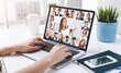 © ImageFlow - Woman hands typing on laptop during video conference