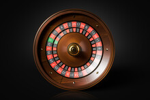 Top View Of Roulette Wheel Over Black Background