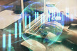 © peshkova - Double exposure of woman hands typing on computer and forex chart hologram drawing. Stock market invest concept.