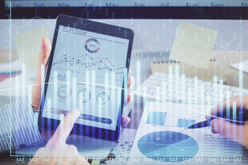 Multi exposure of man's hands holding and using a phone and financial chart drawing. Market analysis concept.