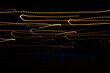 Golden threads, yellow neon signs on a black background.