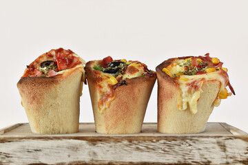 Organics and delicious pizza cones with a crunchy thin crust, lots of melted cheese, fresh vegetables and fine spices