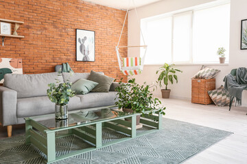 Interior of living room with stylish hammock