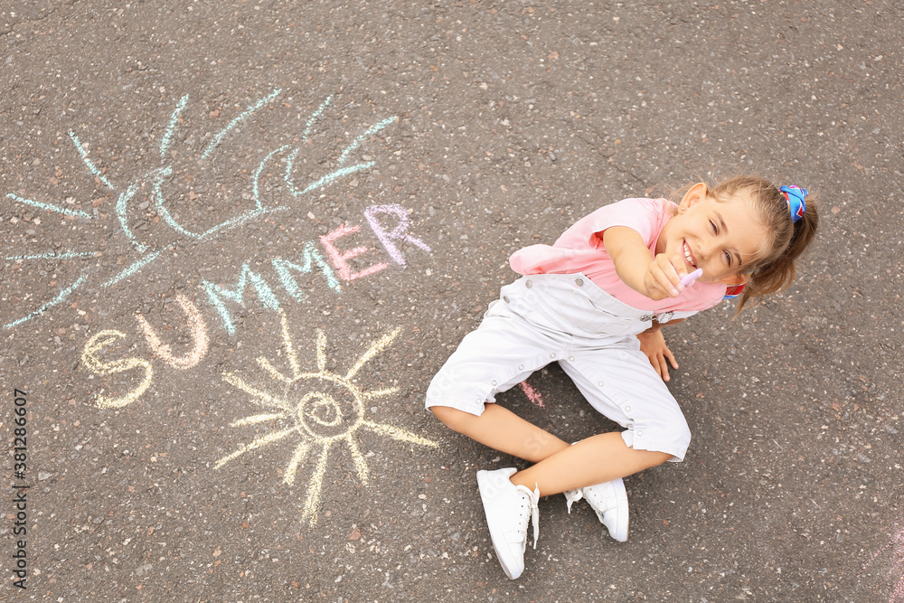 Little girl with written word SUMMER on asphalt