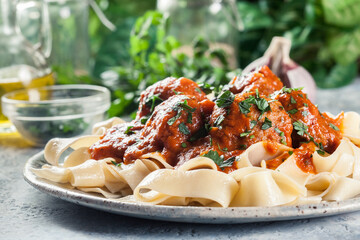 Wall Mural - Meatballs with tomato sauce served with pappardelle pasta