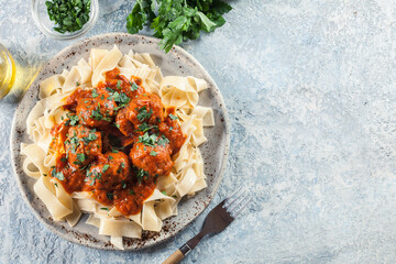 Wall Mural - Meatballs with tomato sauce served with pappardelle pasta