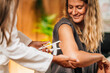 © Microgen - Body Fat Test, Using Caliper on the Female Patient's Arm