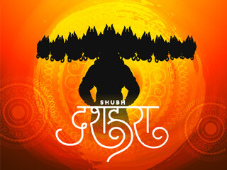 Canvas Print - Shubh (Happy) Dussehra Text with Silhouette Demon Ravana and Yellow Brush Stroke Effect on Orange Mandala Pattern Background.