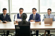 © imtmphoto - female asian candidate being interviewed by a group of business people