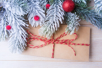 Wall Mural - Envelope and frosty Christmas tree branches with decoration. Xmas and New Year concept