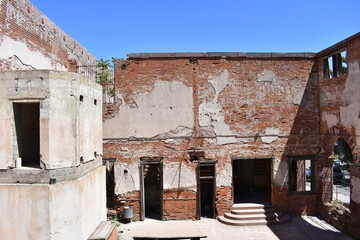 Wall Mural - Abandoned brick building with weathered walls