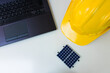 © Andre Nery - Solar Cell Energy concept image. Solar panel, safety helmet and work tools isolated on white. Text Space.