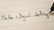 © Keitma - Beginner Polish language learner writing Hello formal word Dzien dobry for homework on a notebook