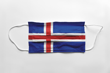 Wall Mural - Face mask with Iceland flag printed, on white background, isolated