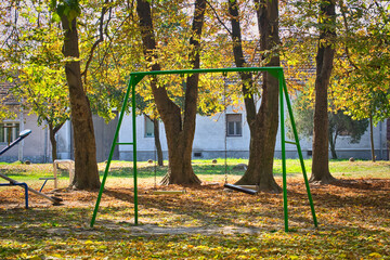 An empty kids' playground in the autumn park of Serbia