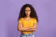 © Prostock-studio - Grumpy Woman. Portrait of serious offended lady standing with crossed arms