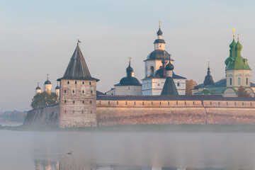 Magnificent landscape at the Orthodox monastery, dawn, lake, fog, close-up