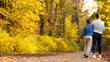 mom and son on a walk in the Park. the yellow foliage. autumn. mother's love for the child