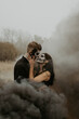Couple in love in black smoke halloween