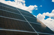 © Inti St. Clair - Solar panels in the desert with blue skies and puffy white clouds