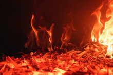 Close-up Of Red Roaring Flames Burning In Fireplace. Romantic And Mesmerizing Flames.