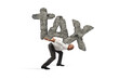 © alphaspirit - Businessman holds the word TAX made of rock