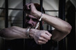 © zwiebackesser - Close up aggressive handcuffed man. Arrest, gangster, pain concept.