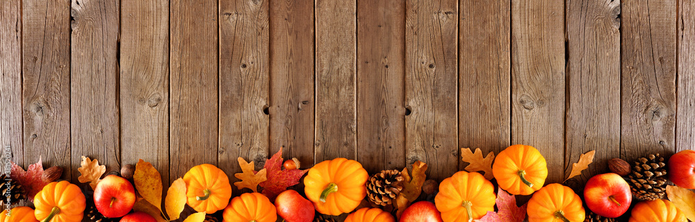 Fall border with pumpkins, leaves and apples. Top view on a rustic dark ...