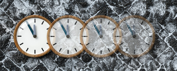 clocks fading away on snowy lava stone street background