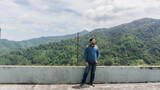 Fototapeta Miasto - Man enjoying mountain view in San Juancito Fracismo Morazan Honduras Central America