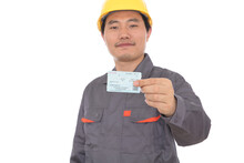 Migrant Workers In Front Of A White Background Show That They Have Just Grabbed A Train Ticket To Go Home For The New Year