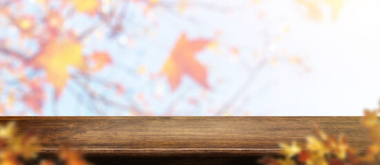Aufkleber - Autumn background.Empty old rustic wood table with blur forest tree with sunlight,Autumn fall backdrop, banner for product display for advertise on online,thanksgiving concept
