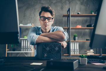 Close-up portrait of his he nice attractive intelligent guy repairman top tech manager inventing innovative solution remote part-time at modern concrete wall interior style work place station indoors