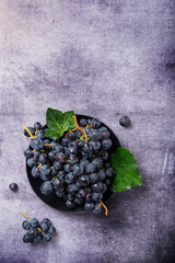 Poster - black grape with green leaves