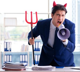 Wall Mural - Devil angry businessman in the office