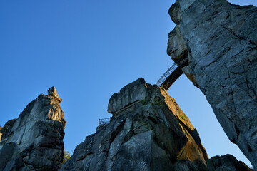 a small round bridge connects two of the rocks of the sandstone formation 