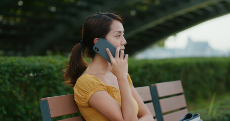 Poster - Woman talk on cellphone at park