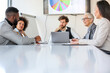 © Sanja - A group of business partners sits in a conference room and arranges new jobs and projects for their corporation